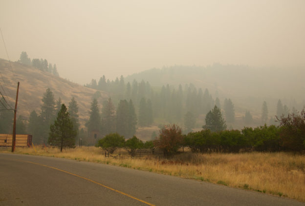 Photo of rural area with thick orange-brown haze from wildfires