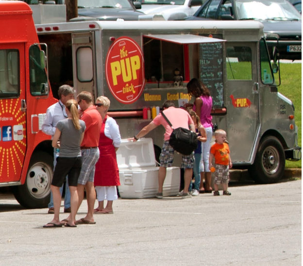 Photo of people buying food from food trucks