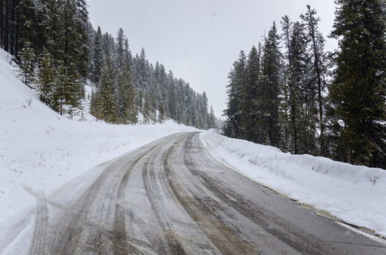 Photo of mountain road with snow and ice