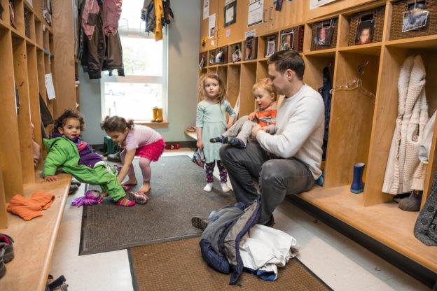 Photo of children and in cloakroom of a child care facility