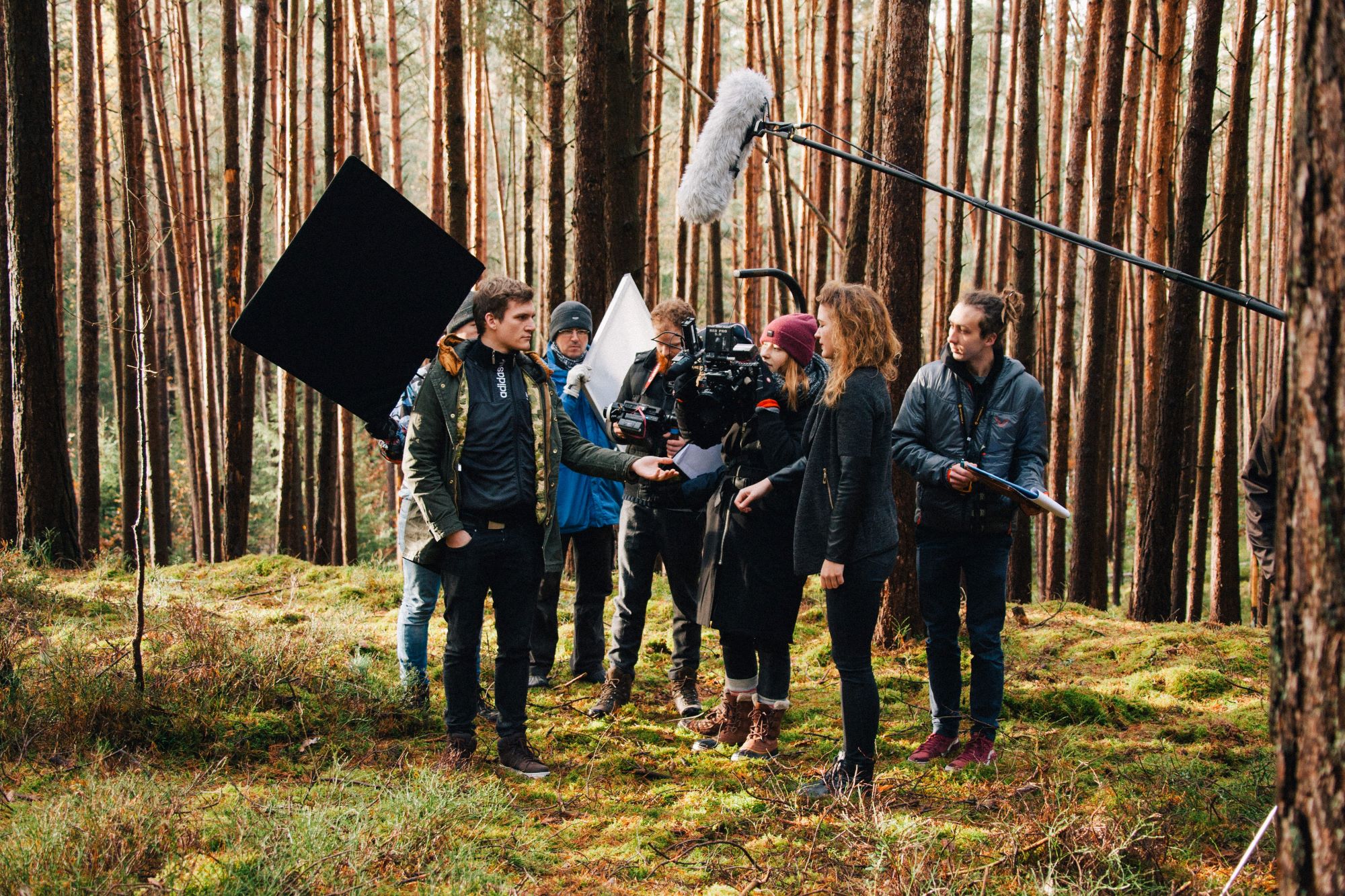 Photo of: Film crew filming movie scene in an outdoor location