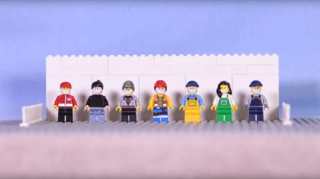 Photo from safety videos shows lego figures as workers standing in a row