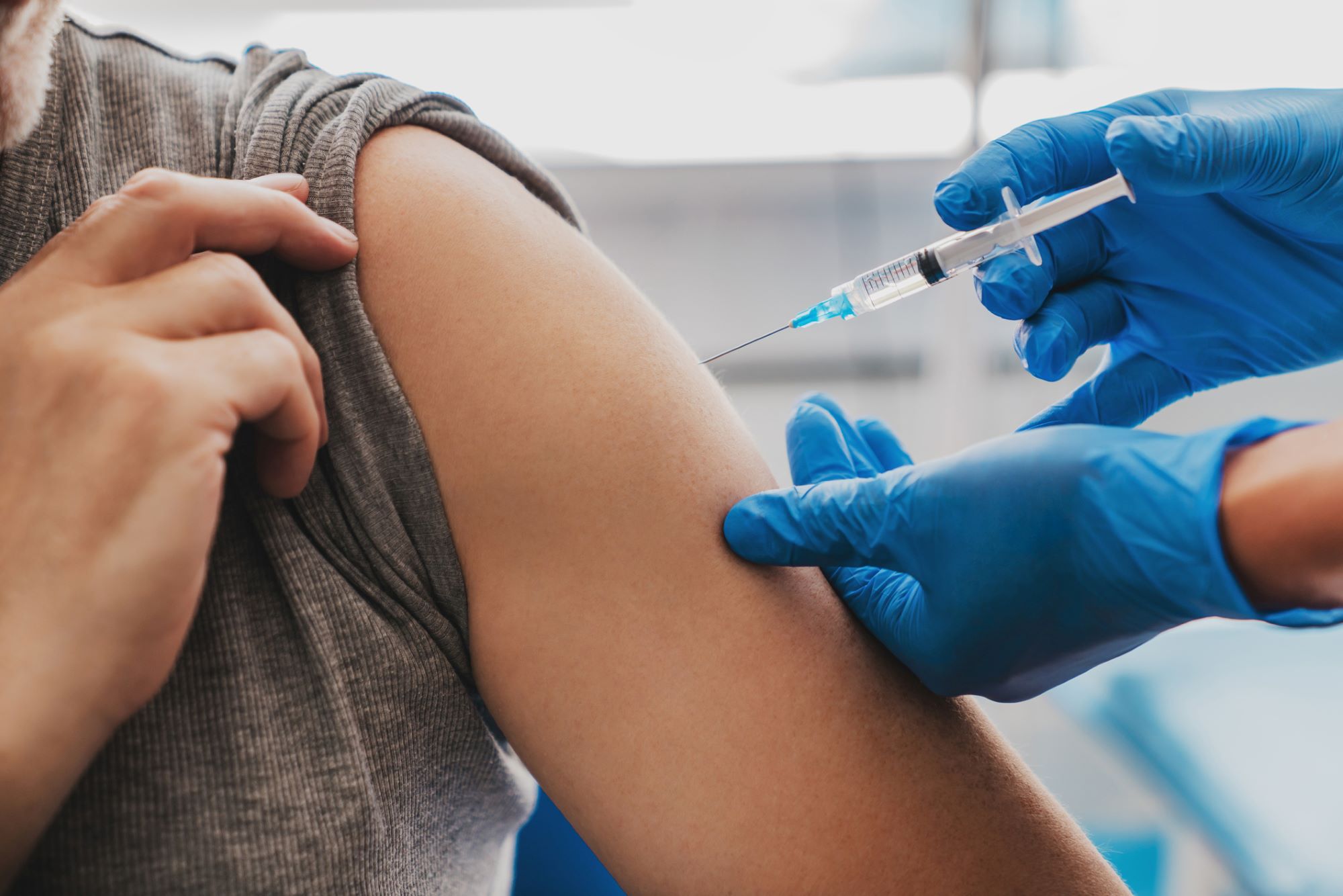Photo of person getting a vaccination in a medical setting