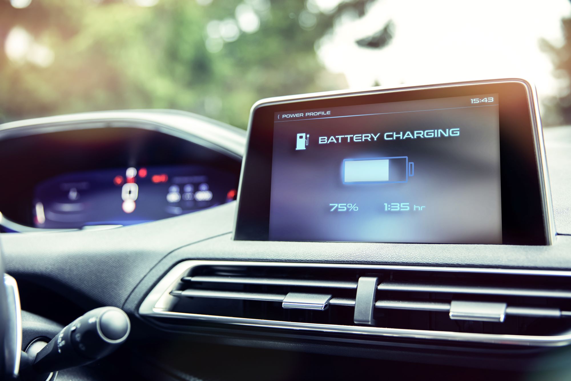 Photo of an electric vehicle battery charge screen in a car showing 75 percent charged.