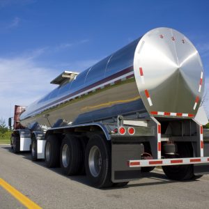 Photo of a fuel tanker truck parked on the road.