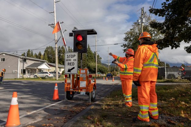 Photo of two traffic control workers pointing to an AFAD during flagger training