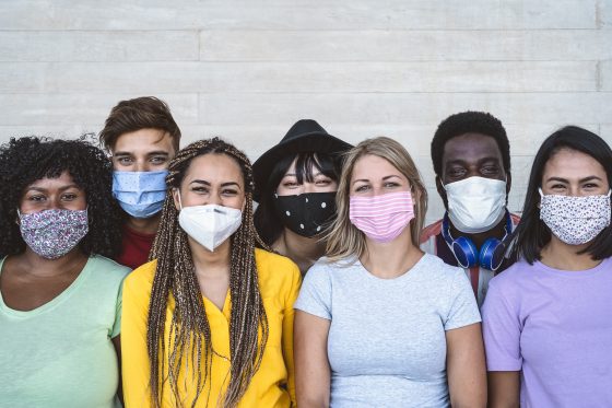 Photo of Group young people wearing face mask for preventing COVID-19 outbreak.