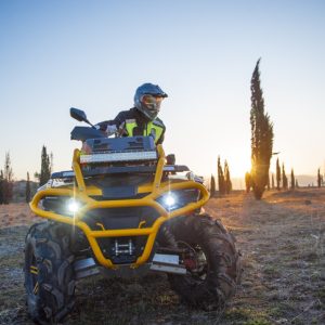 Photo of individual on ATV wearing PPE