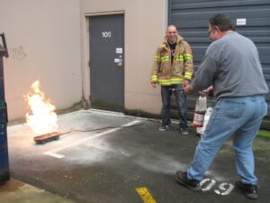 Ventana staff get hands-on - reviewing proper use of fire extinguishers. 